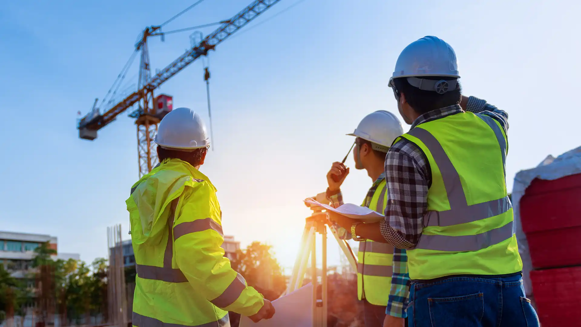 Types of surveys in construction – Construction workers looking at a crane