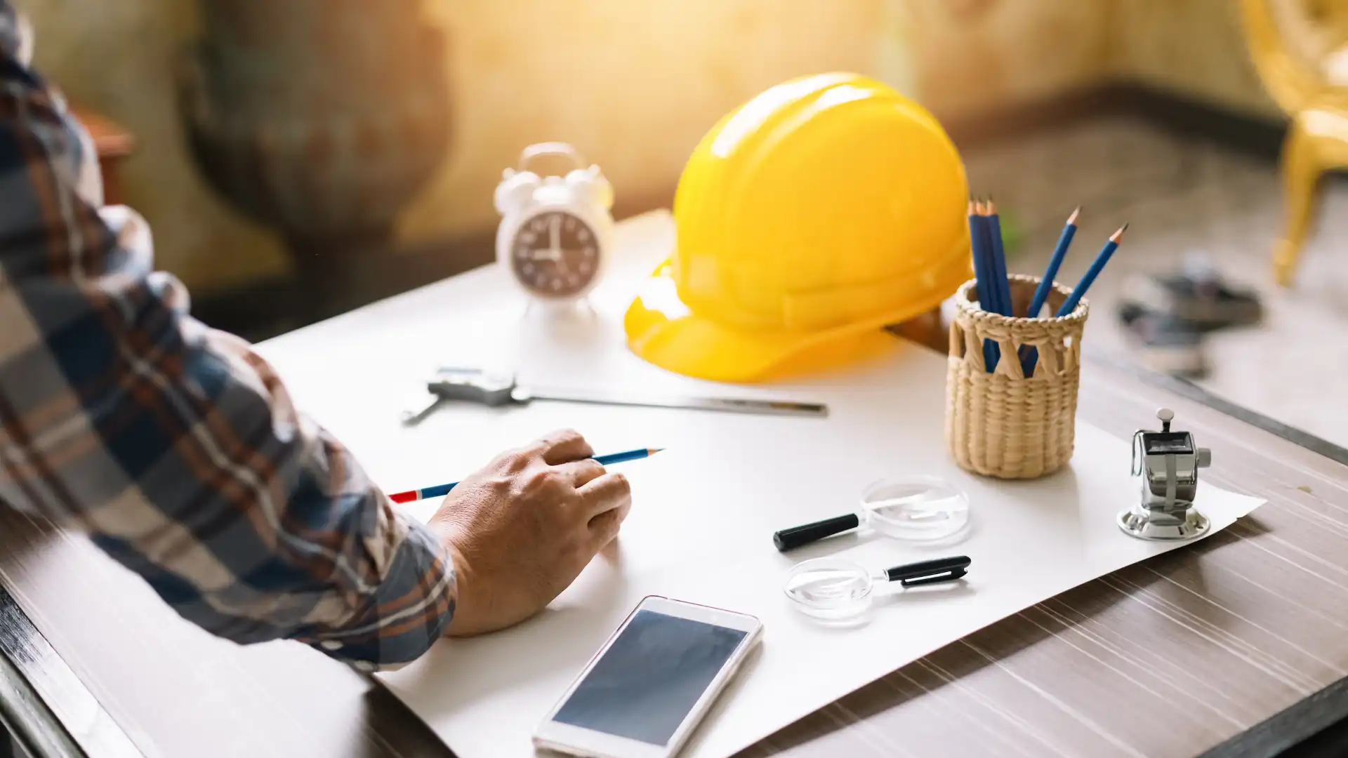 What is surveying in civil engineering – An engineer looking at designs