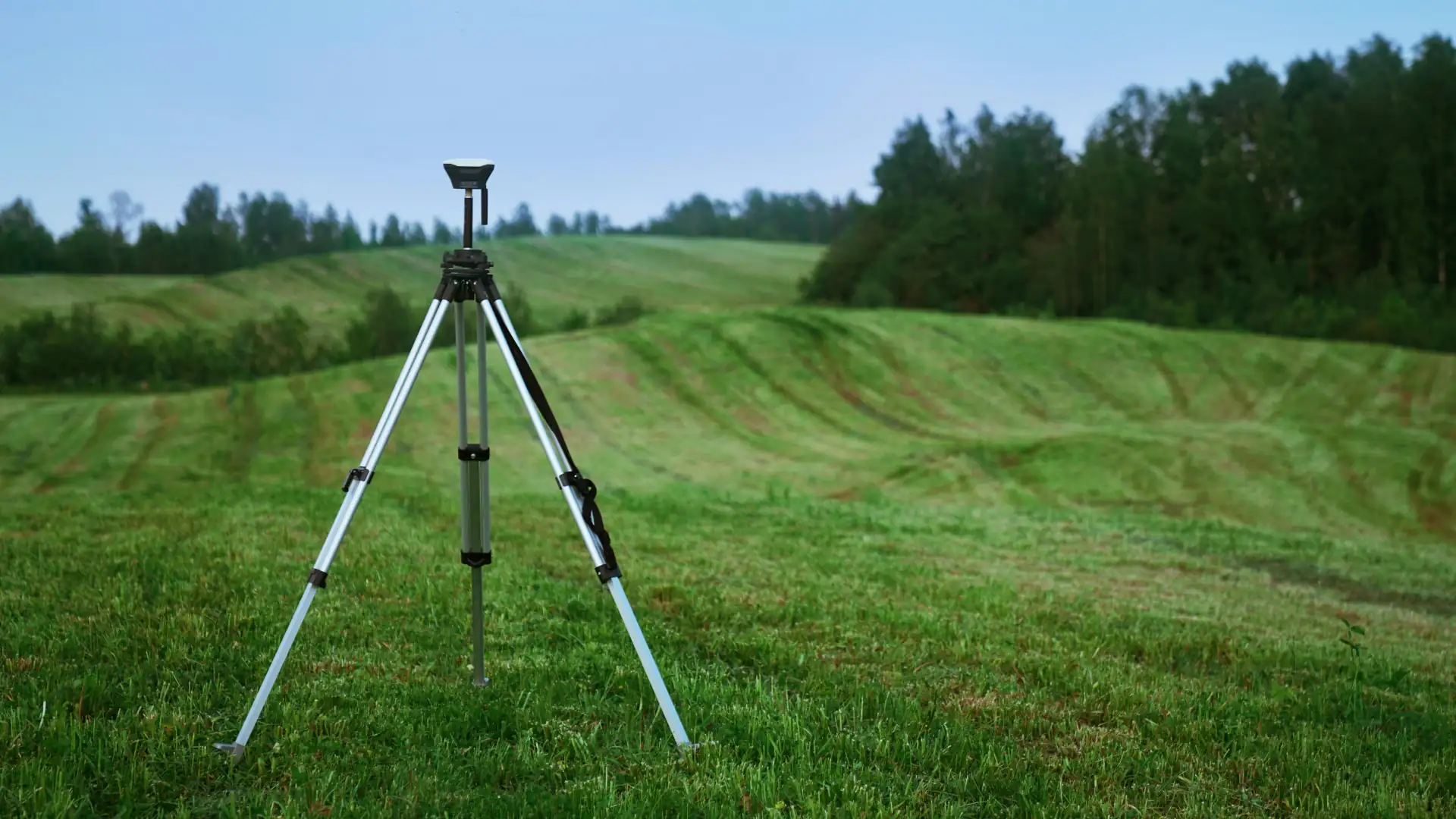 Survey equipment in grass field - freehold subdivision NZ