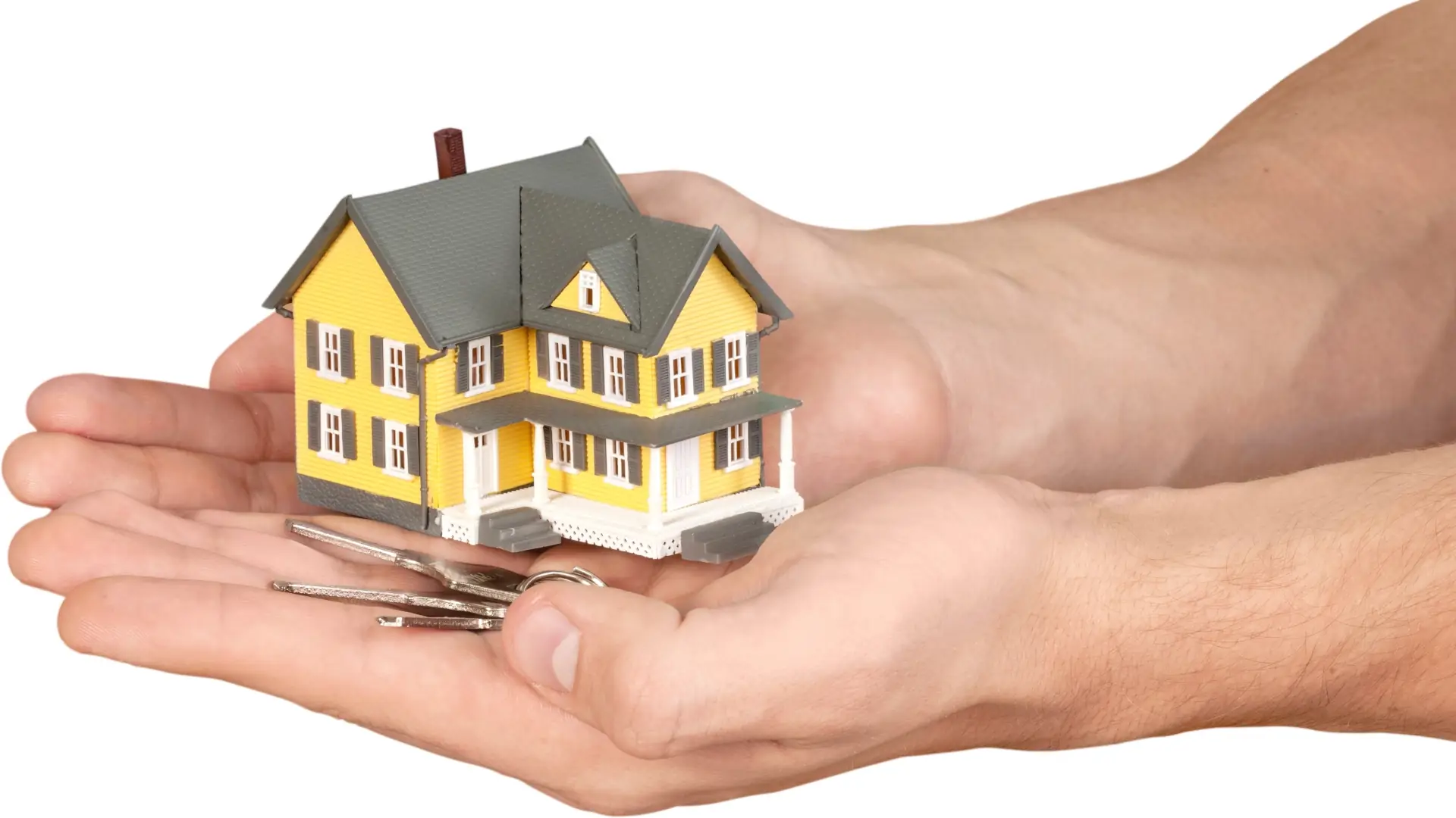 Pair of hands holding model house and key